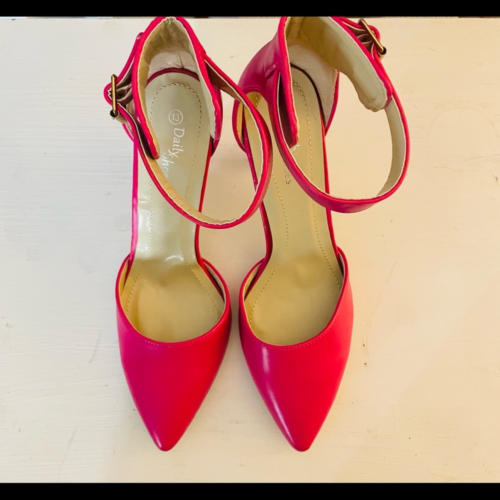 Women’s hot pink high heel shoes with side buckle.